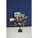 A CAST IRON 20th CENTURY WEATHERVANE, with a Land Rover model to pointer, 54cm high