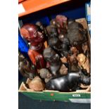 A BOX OF WOODEN TOURIST TRIBAL ITEMS, to include mainly busts and figures of men and women,