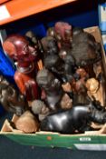 A BOX OF WOODEN TOURIST TRIBAL ITEMS, to include mainly busts and figures of men and women,