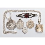 A SMALL BAG OF JEWELLERY, to include two circular St. Christopher pendants, one signed 'Georg