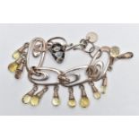 A GEM SET BRACELET AND A MOONSTONE RING, the bracelet designed with four openwork oval links,