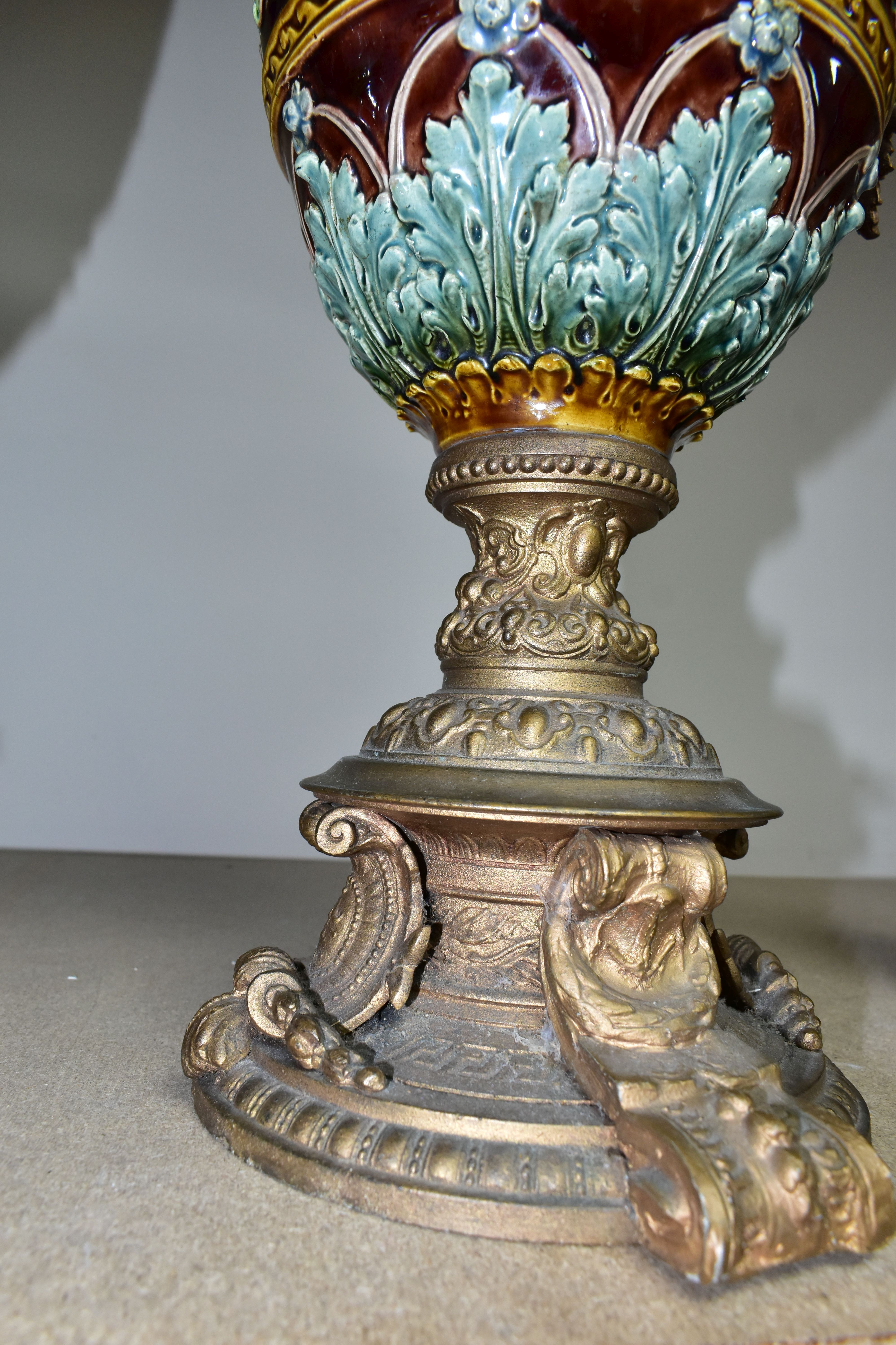 A PAIR OF LATE VICTORIAN GILT SPELTER AND MAJOLICA EWERS, the scrolling handle cast with a beast and - Image 3 of 5