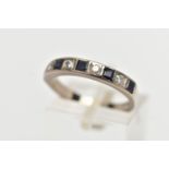 A WHITE METAL SAPPHIRE AND DIAMOND HALF ETERNITY BAND RING, set with four round brilliant cut