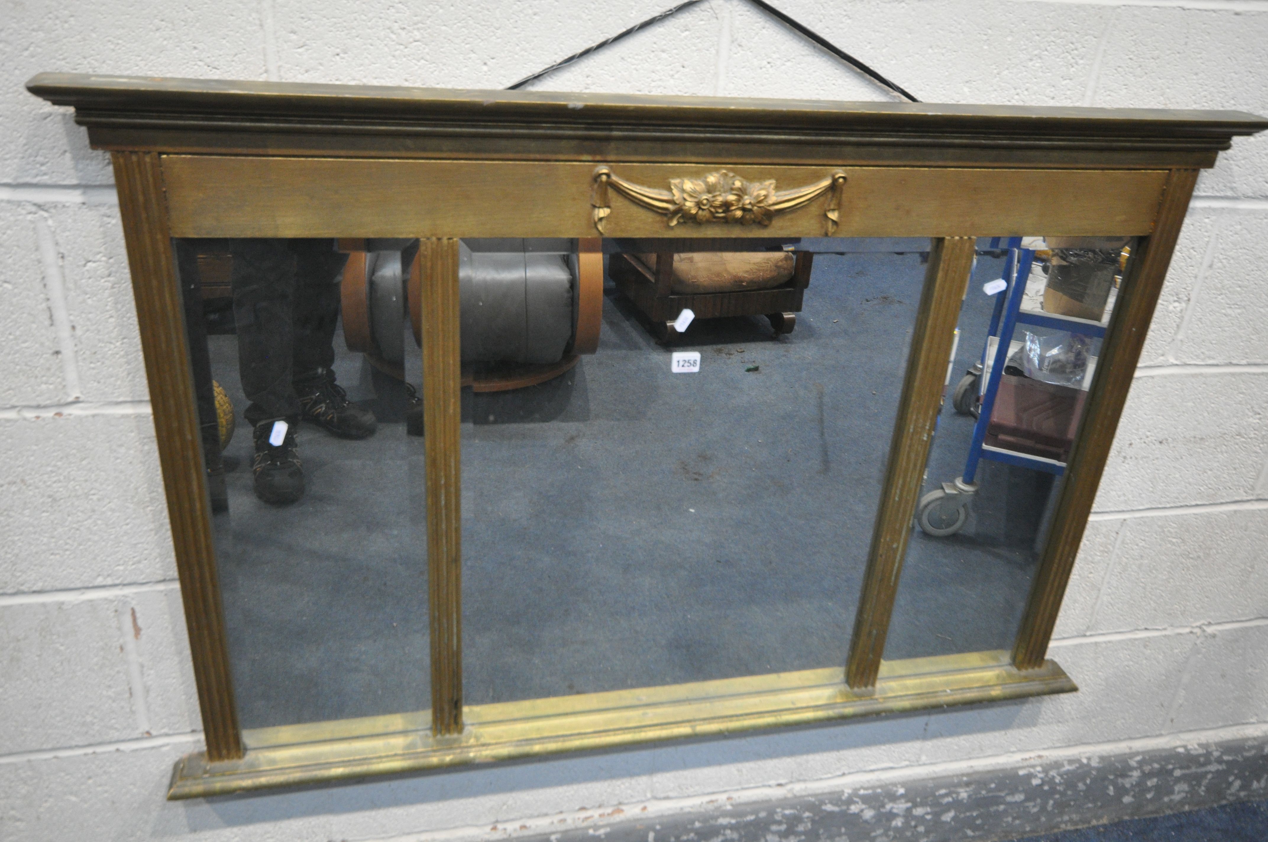 A REGENCY STYLE GILT FRAMED OVERMANTEL MIRROR, with triple bevelled mirrors, width 128cm x 84cm (