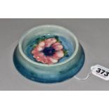A MOORCROFT POTTERY ANENOME BOWL, of unusual form with a flared foot, graduated blue ground,