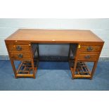 AN ORIENTAL QING DYNASTY STYLE HARDWOOD PEDESTAL DESK, with four drawers, on a base width 155cm x