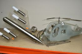 TWO NOVELTY LIGHT FITTINGS, in the form of a helicopter and a jet aeroplane, in metal and Perspex,