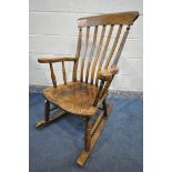 A 20TH CENTURY ELM AND BEECH ROCKING CHAIR