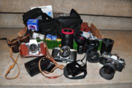 A TRAY CONTAINING FILM SLR CAMERAS including a Asahi Pentax Spotmatic fitted with a Super Takumar