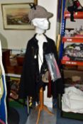 POLICE INTEREST: A POLICE OFFICER'S CAPE, A STRAITJACKET AND OTHER ITEMS OF CLOTHING WITH MANNEQUIN,