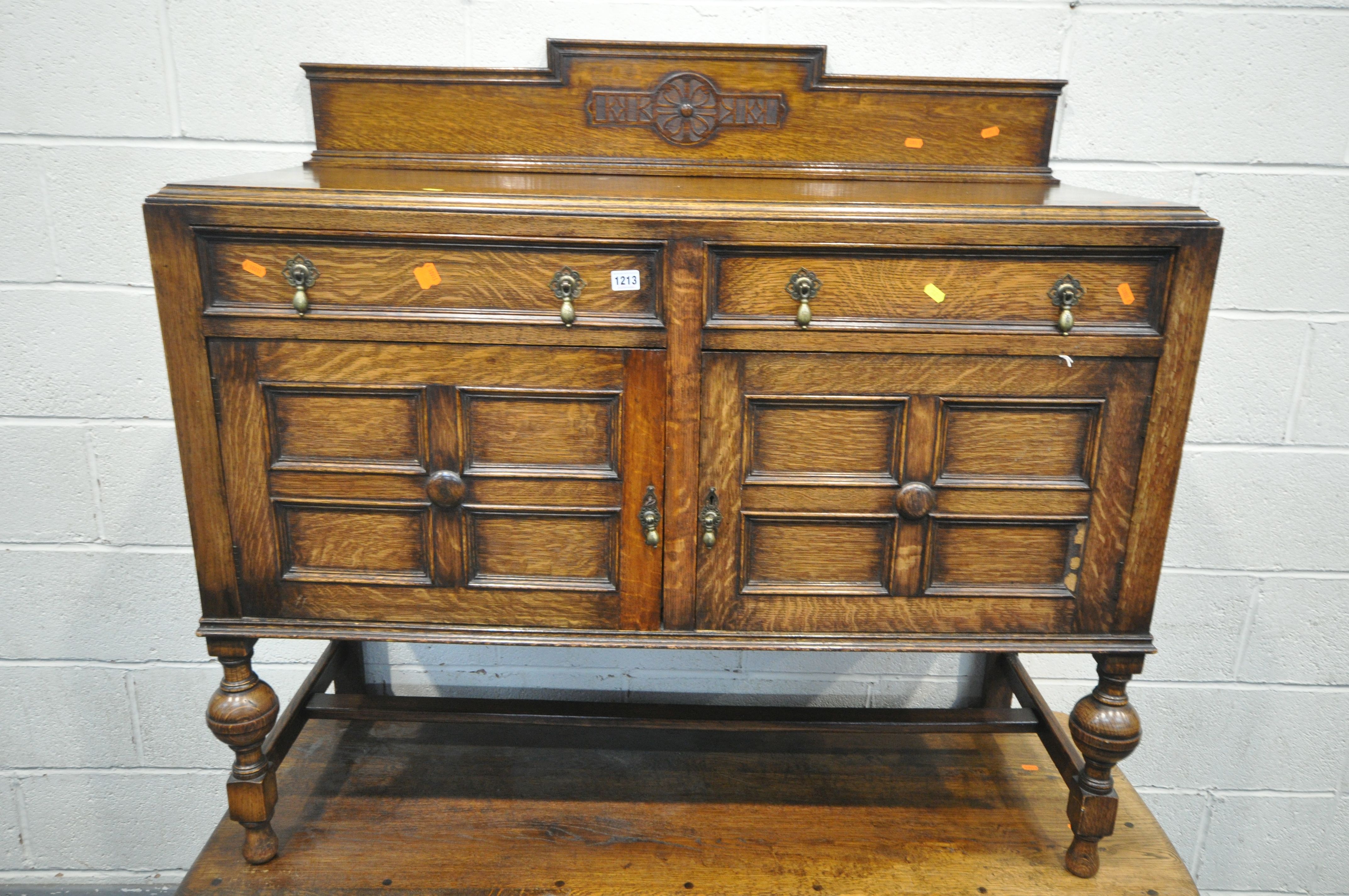 A 20TH CENTURY OAK SIDEBOARD, with a raised back, two drawers, and double cupboard doors, width - Image 2 of 2