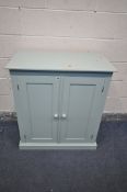A TEAL PAINTED PINE TWO DOOR CABINET, enclosing two adjustable shelves, width 85cm x depth 46cm x
