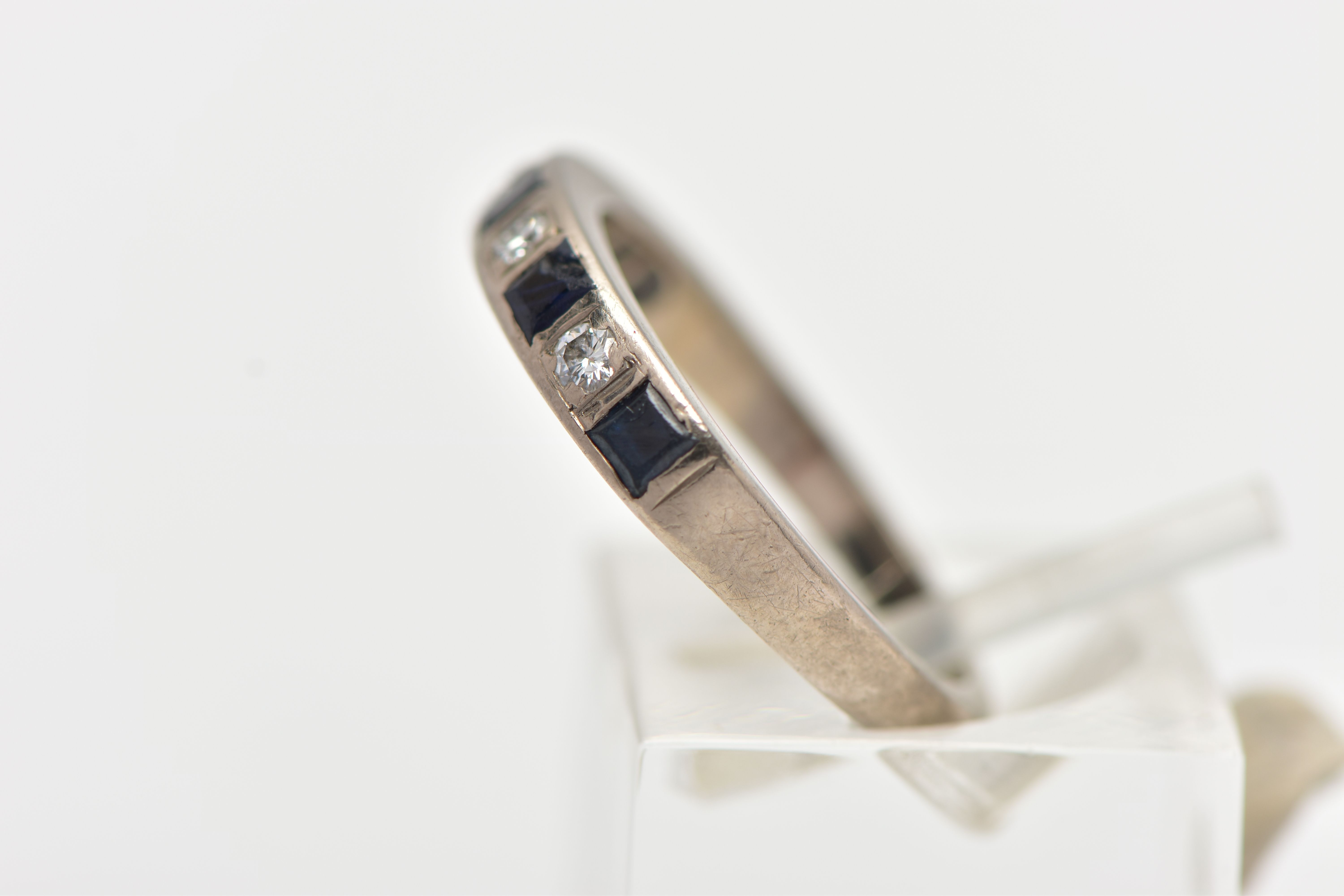 A WHITE METAL SAPPHIRE AND DIAMOND HALF ETERNITY BAND RING, set with four round brilliant cut - Image 2 of 4