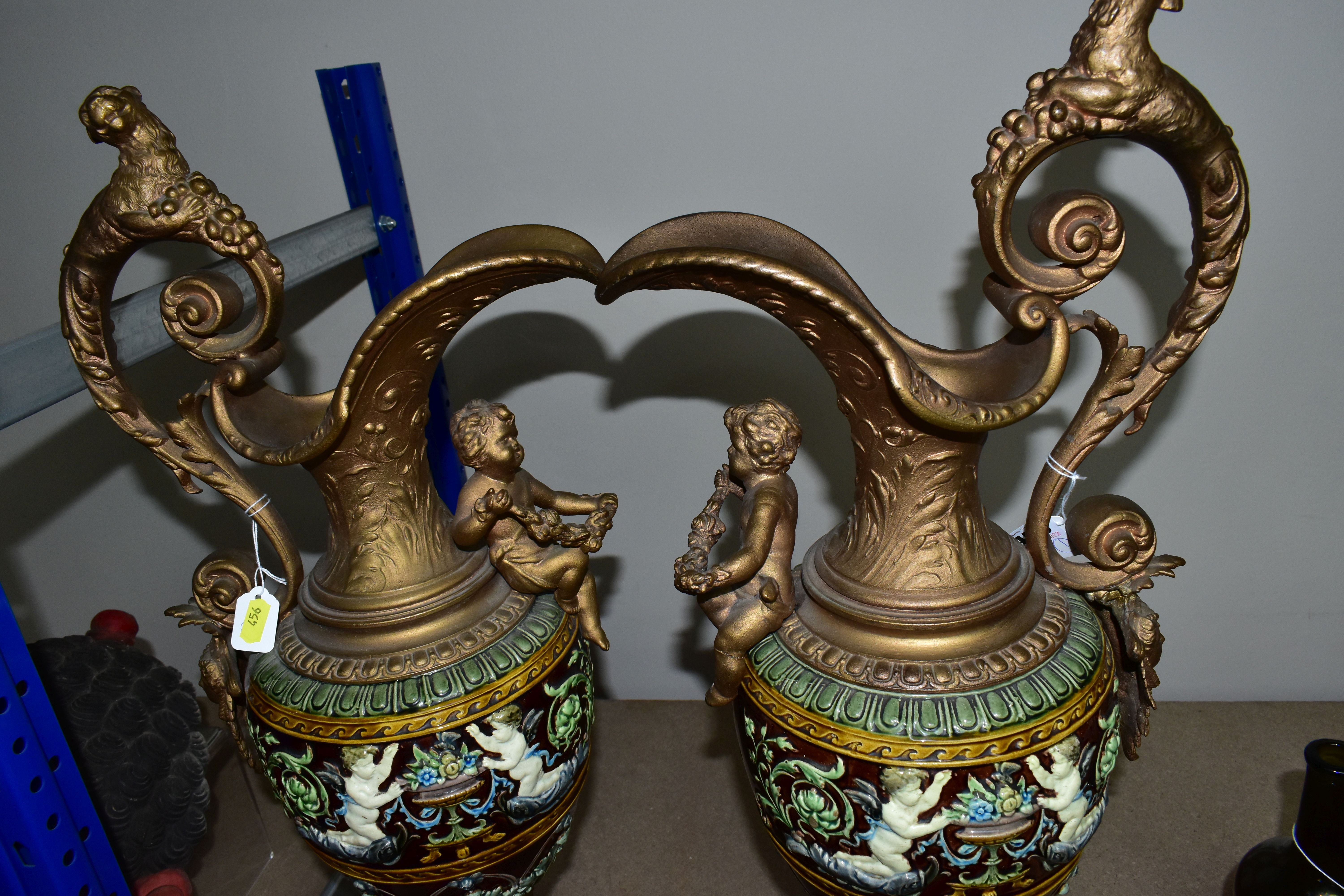 A PAIR OF LATE VICTORIAN GILT SPELTER AND MAJOLICA EWERS, the scrolling handle cast with a beast and - Image 5 of 5