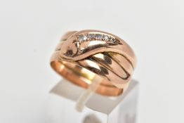 A 9CT COILED SNAKE RING, wide band of a coiled snake, the head is set with five graduated round