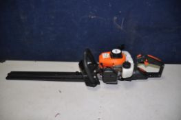 A VIDAXL.COM PETROL HEDGE TRIMMER with 22in cut ( engine pulls freely but hasn't started)