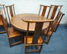 AN ORIENTAL QING DYNASTY STYLE HARDWOOD CIRCULAR DINING TABLE, with a lazy Suzan, on a shaped