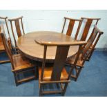 AN ORIENTAL QING DYNASTY STYLE HARDWOOD CIRCULAR DINING TABLE, with a lazy Suzan, on a shaped