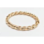 A MODERN 9CT YELLOW GOLD HINGED BANGLE, designed as a plain polished twist, with concealed push