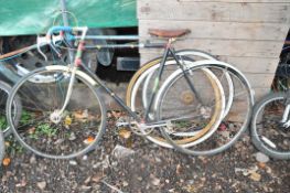 A FREDDIE GRUBB VINTAGE RACING BIKE, with 5 speed lever Campagnolo gears, a tatty Brookes leather