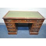 A BRIGHTS OF NETTLEBED MAHOGANY PEDESTAL DESK, with a green leather writing surface, and nine