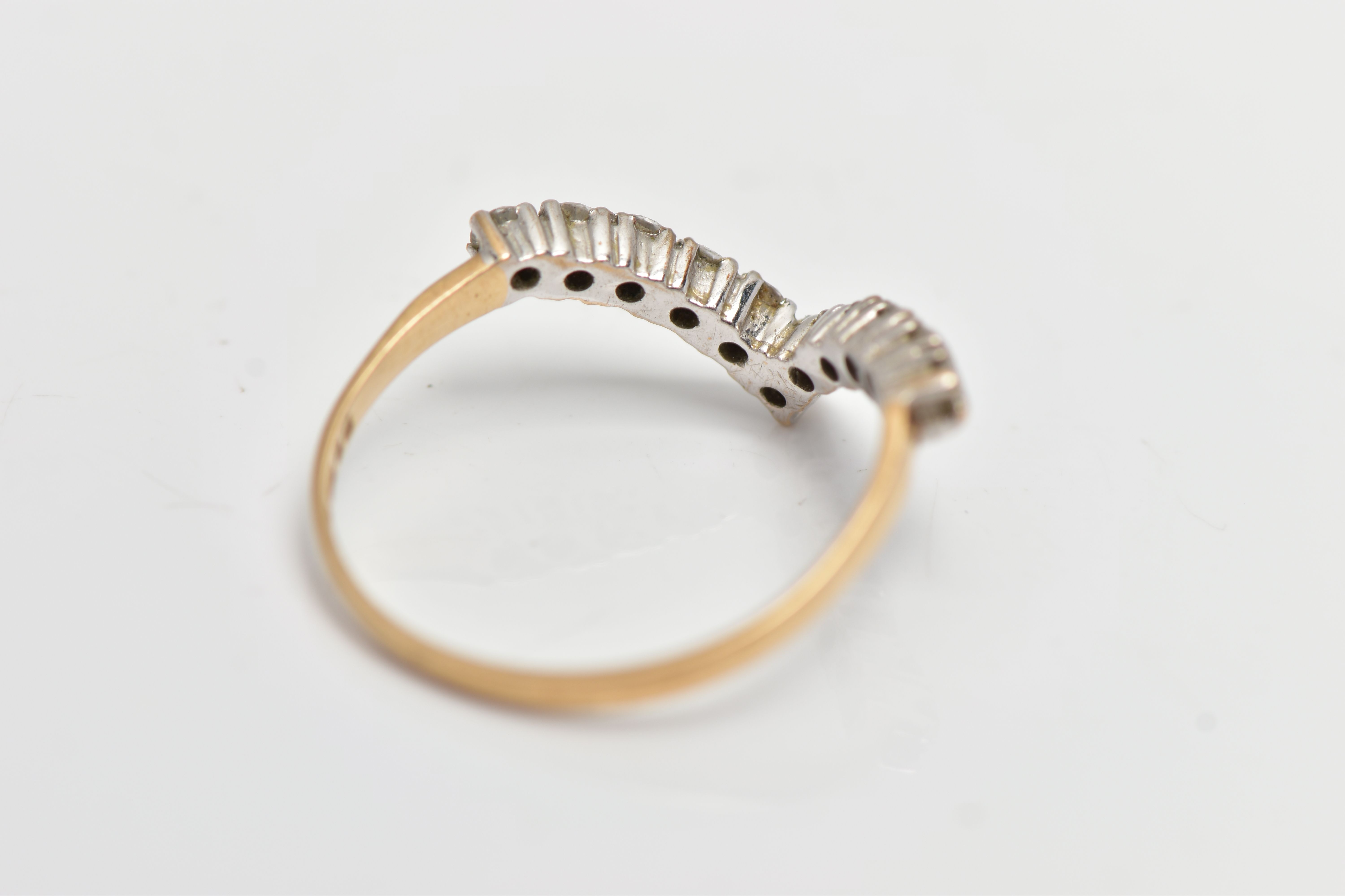 A 9CT YELLOW GOLD DIAMOND WISHBONE RING, designed with a row of eleven claw set, round brilliant cut - Image 3 of 4