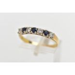 A YELLOW METAL SAPPHIRE AND DIAMOND HALF ETERNITY RING, designed with a row of four claw set,