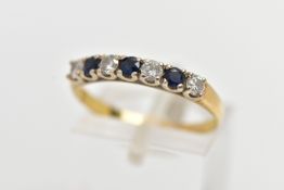 A YELLOW METAL SAPPHIRE AND DIAMOND HALF ETERNITY RING, designed with a row of four claw set,