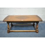 A 20TH CENTURY OAK COFFEE TABLE, on a shaped tapered support united by a box stretcher, length 106cm