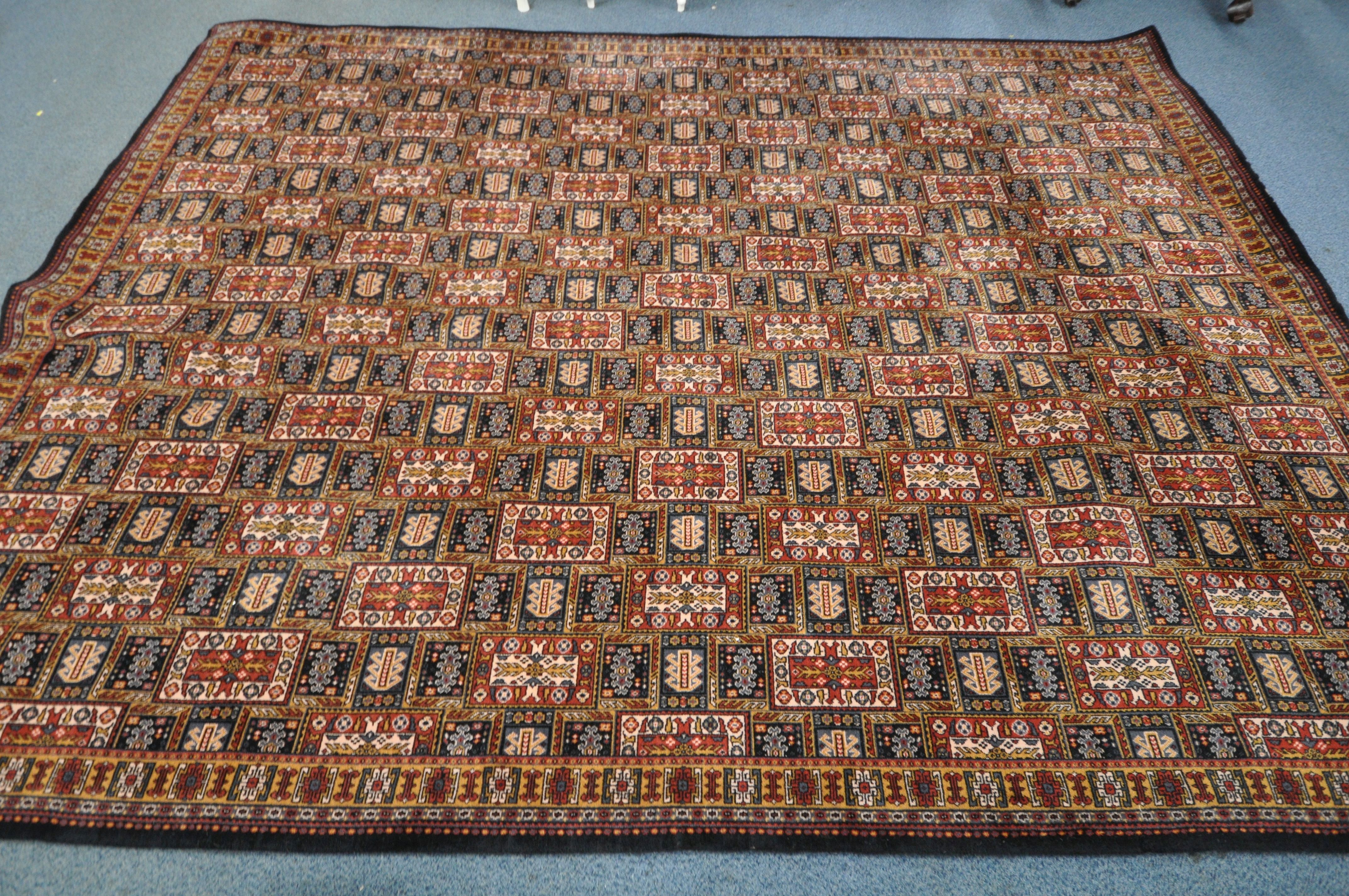 A GROSVENOR 100% WOOLLEN CARPET SQUARE, of a multicolour design in a geometric style, 366cm x