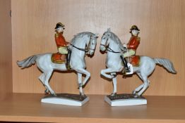 TWO UNTERWEISSBACH PORCELAIN HORSES AND RIDERS, the riders in military style uniform with red and