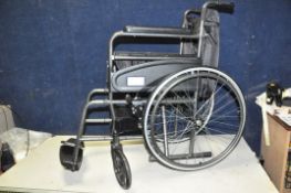 AN AIDAPT FOLDING WHEELCHAIR, with footrests