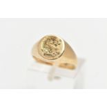 A 9CT YELLOW GOLD INTAGLIO SIGNET RING, of an oval form, engraved intaglio to the centre, to a