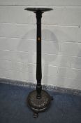 A MAHOGANY TORCHERE STAND, on a circular base with floral base, and triple claw legs, height