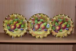 THREE HANDPAINTED CABINET PLATES PAINTED BY J MOTTRAM, each painted with apples, a pear and berries,