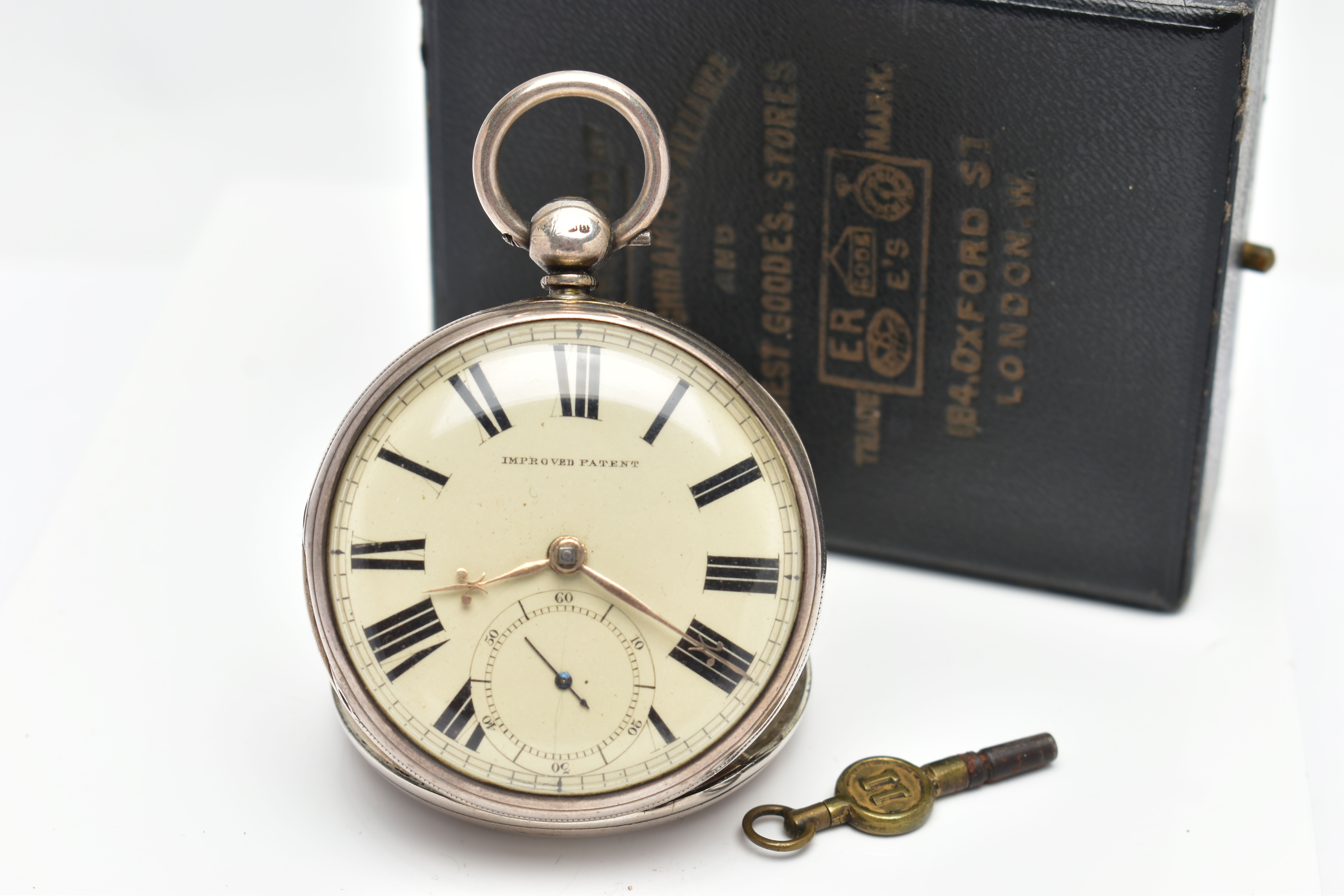 A CASED SILVER OPEN FACE POCKET WATCH, key wound, round cream dial signed 'Improved Patent', large