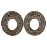 A pair of Chinese carved wood oval frames, 19th century, each with panels depicting various