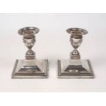 A pair of Edwardian silver candlesticks, London, 1900, William Hutton & Sons, designed with