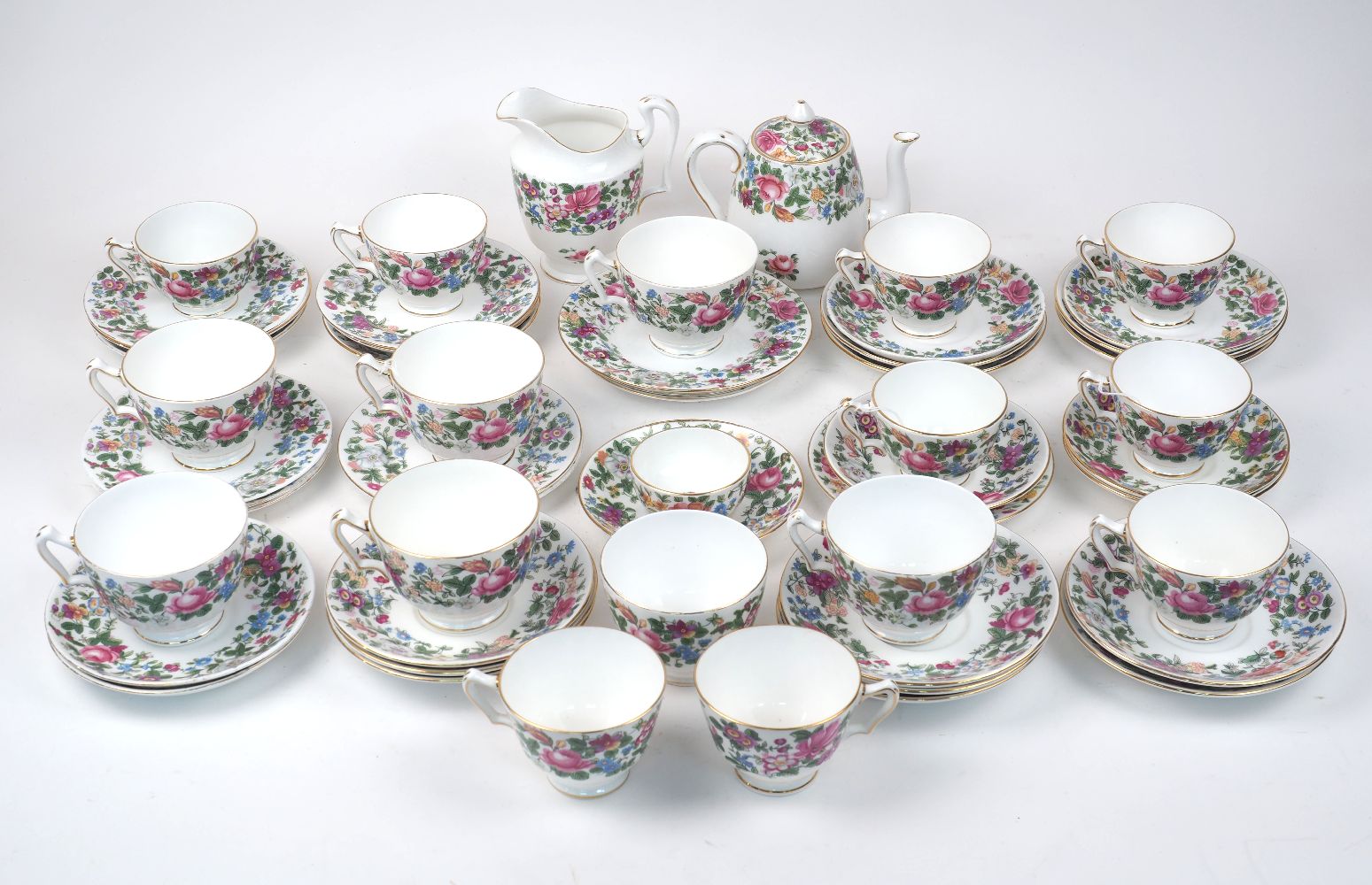 A quantity of Crown Staffordshire tea set pieces, early 20th century, decorated with a floral