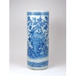 A Chinese porcelain umbrella stand, late 19th century, painted in underglaze blue with birds amid