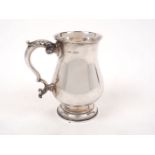 A George VI silver tankard, Sheffield, 1967, Walker & Hall, of plain baluster form with acanthus