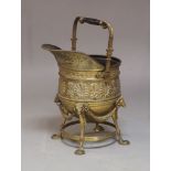 A French brass coal scuttle and a coopered oak jug-form coal scuttle, early 20th century, the