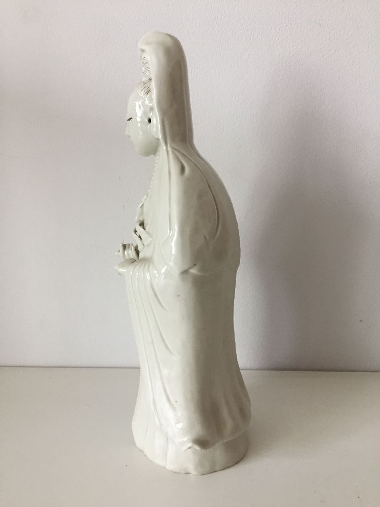 A Chinese Dehua porcelain figure of Guanyin, 19th century, modelled standing with long flowing - Image 6 of 11
