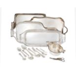 A set of three silver plated trays with scroll handles, of various sizes, each with pierced