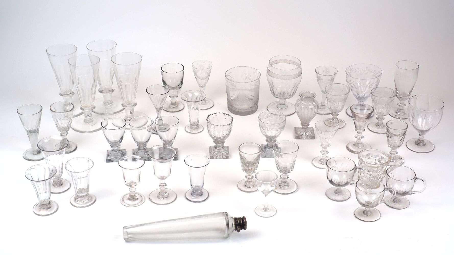 A collection of drinking glasses, 19th century and later, to include: a tumbler engraved with an