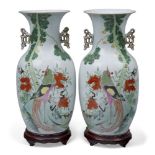 A pair of Chinese famille rose vases, Republic period, decorated with birds and foliage, inscribed