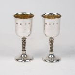 A pair of silver wine cups, London, 1979, Anthony Gordon Elson, the plain cups with gilded interiors
