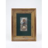 A framed lock of hair momento mori, dated 1832, threaded with pearls, above, a cameo of child,