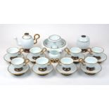 A Silk Road porcelain tea set, comprising a dish with raised centre, teapot with internal tea leaf