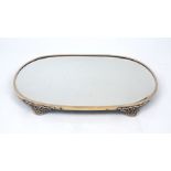 A mirrored surtout-de-table, of oval form, with silver plated surround and pierced bracket feet,